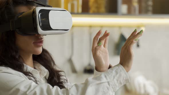 Biracial Young Woman in Goggles Examines Virtual Reality