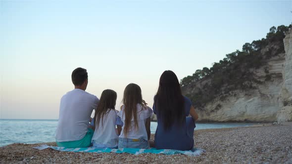 Happy Beautiful Family with Kids on the Beach