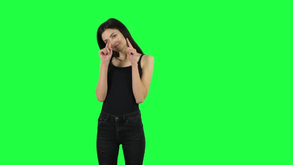 Young Girl Smiles and Showing Heart with Fingers Then Blowing Kiss. Green Screen