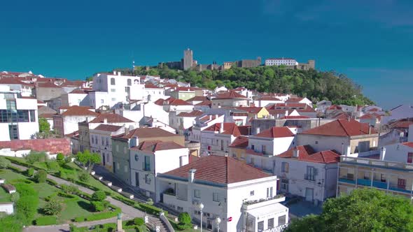 Castle with Houses with Red Roof Near the City Sesimbra Atlantic Coast of Portugal Timelapse