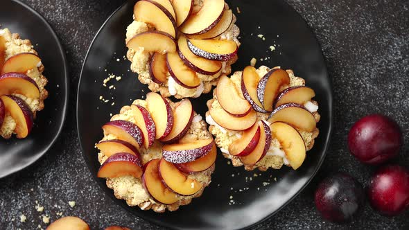 Delicious Homemade Mini Tarts with Fresh Sliced Plum Fruit