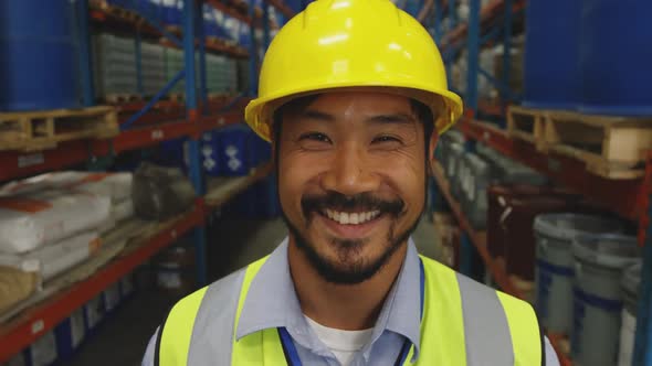 Portraitr of a male worker in a warehouse