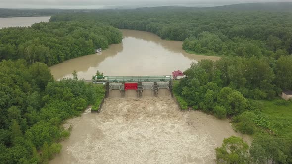 Aerial View of the Dam During Floods. Extremely High Water Level in the River.