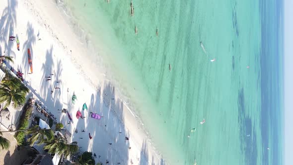 Vertical Video Boats in the Ocean Near the Coast of Zanzibar Tanzania Aerial View