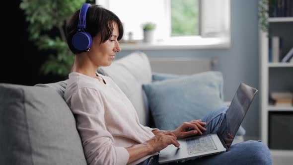 Woman Working on Laptop Remotely