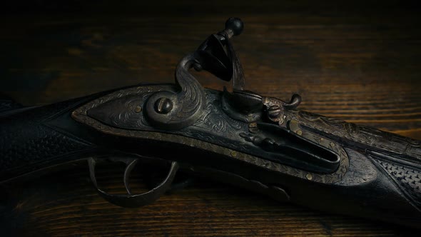 Old Musket Gun On Wooden Table