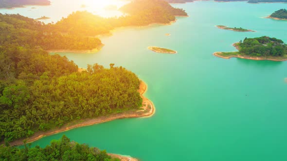 An aerial view from a drone flying over a dam, beautiful turquoise water