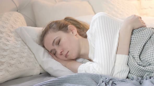 Young  Woman Sleeping in Bed