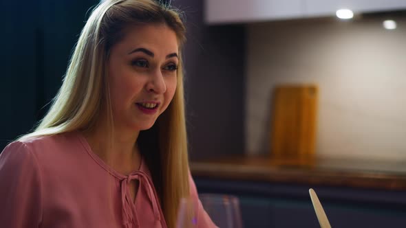 Woman Eats Salad and Enjoys Conversation with Sweetheart