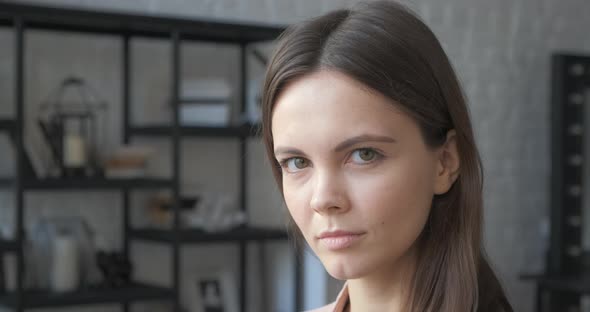 Close Up of Young Attractive Woman. Milennial Businesswoman Smiles. Relaxed Beatiful Female with