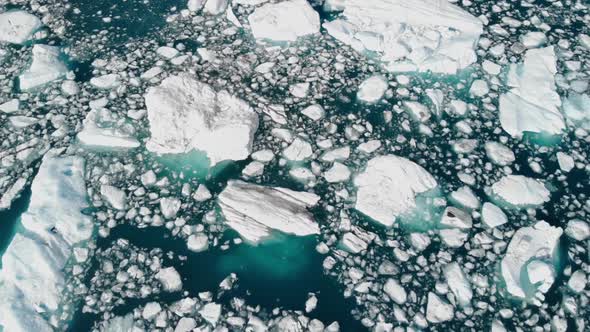 Scenery Of Drifting Ice Floats With Cruising Ship In The Middle At Alaska, USA. - Aerial Drone Shot