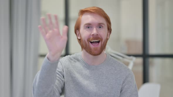 Portrait of Young Redhead Man Waving, Welcoming