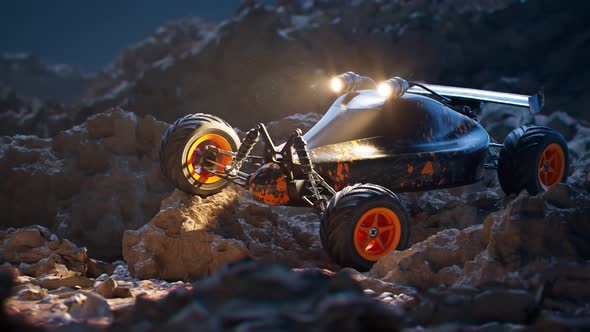 Remote-controlled car standing on rocks during the night. Camera pitch. 4KHD