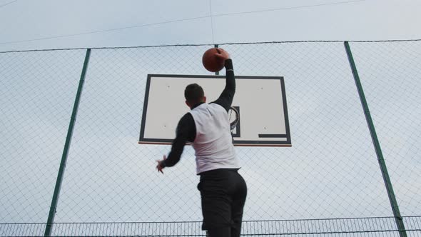 Man scoring a point during a basketball game