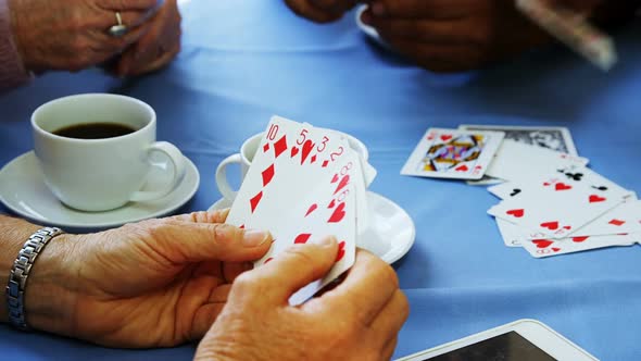 Senior friends playing cards at nursing home 4k