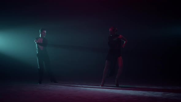 Beautiful Dancers Raising Hands on Stage