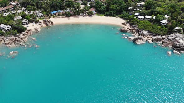 Small Houses on Tropical Island. Tiny Cozy Bungalows Located on Shore of Koh Samui Island