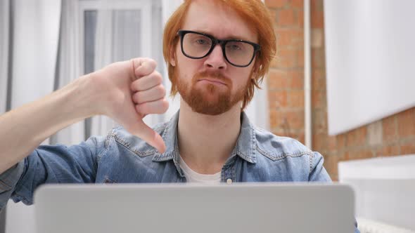 Thumbs Down by Redhead Beard Man