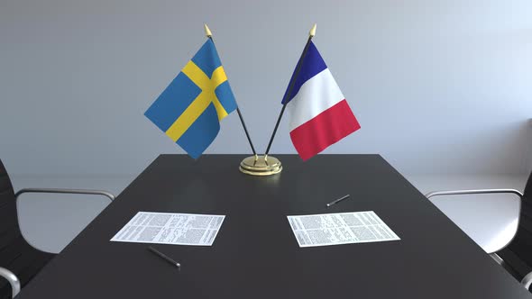 Flags of Sweden and France on the Table alt