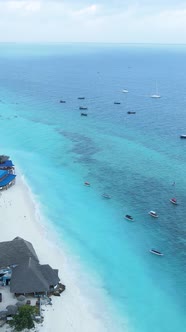 Vertical Video Boats in the Ocean Near the Coast of Zanzibar Tanzania