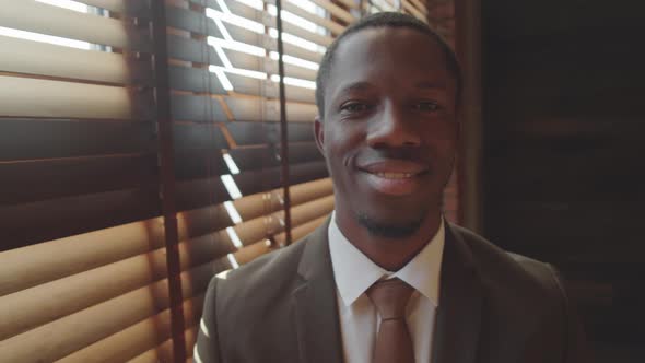 Portrait of Cheerful Black Businessman in Office