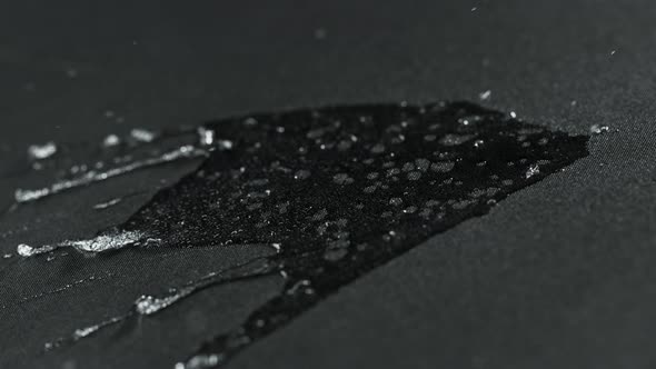 Super Slow Motion Shot of Water Splashing on Waterproof Cloth at 1000Fps