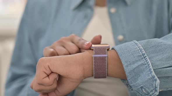 Close Up of African Woman Using Smartwatch