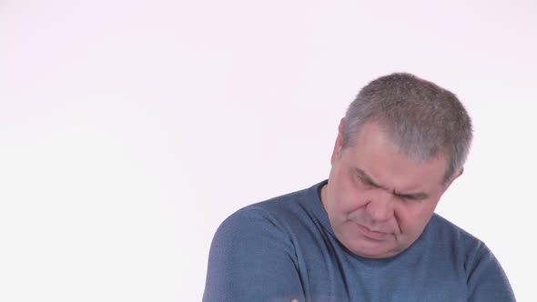 Headache Torments Middle Aged Man. White Background . Close Up