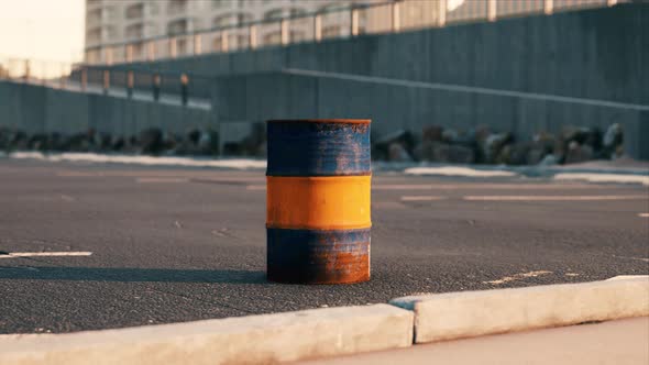 Old and Rusty Metal Barrel on Parking