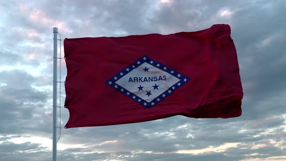 Realistic Flag of Arkansas - US State Waving in the Wind Against Deep Dramatic Sky