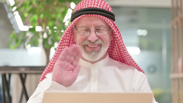 Old Arab Businessman Doing Video Call on Laptop 