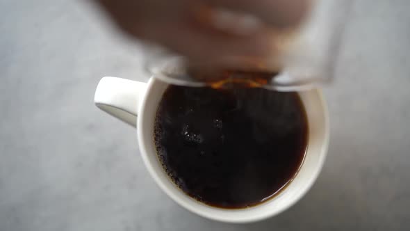 Woman making coffee at home