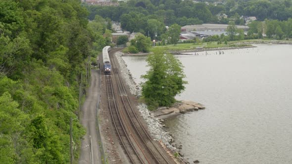 Aerial of Commuter Train by the Hudson River