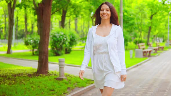 Brunette Girl Going To the Camera Happy Smiling