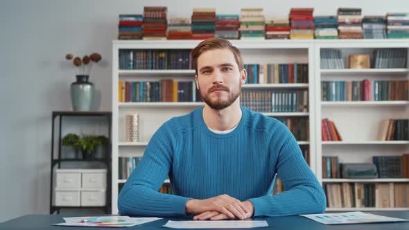 Listening young teacher communicate via video link with student