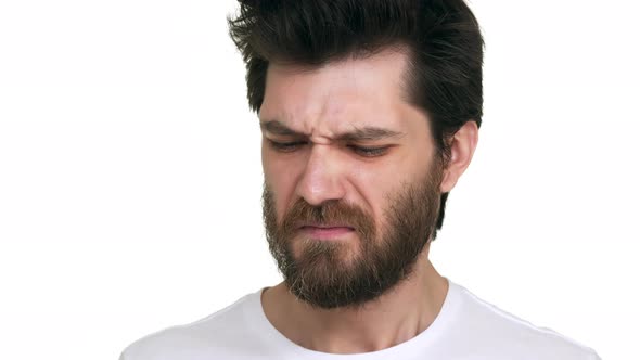 Caucasian Man Smelling Stinky Crinkle Face on White Background