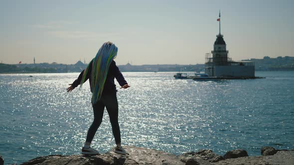 Young Hipster Woman Walking Along Coast Against Maidens Tower Istanbul Turkey