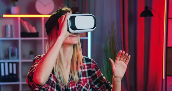 Blond Girl which Applying Virtual Reality Headset During Working at Home