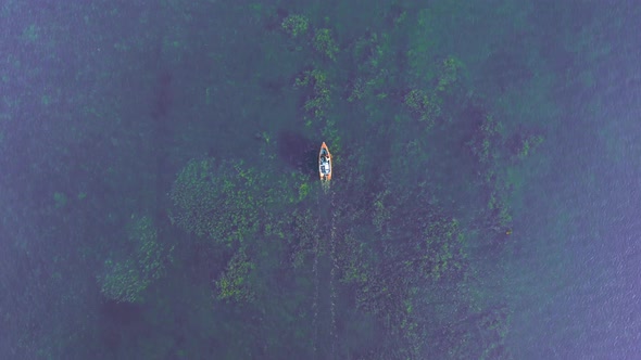 Drone flies over lake starnberg. Aerial view of sailing boat. Beautiful landscape recreational area