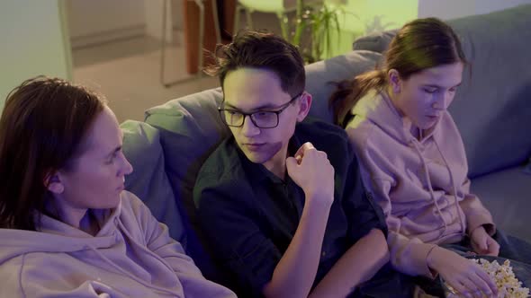 Family of One Parent Son and Daughter Watching TV