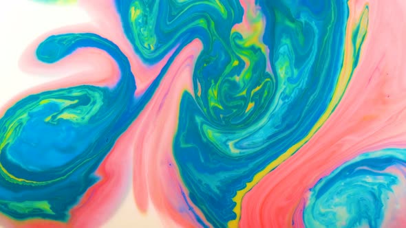 Colorful Paints Mixed in Milk on the Surface