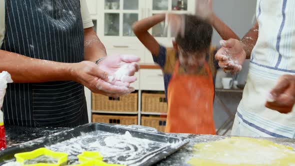 Family playing with flour in kitchen 4k