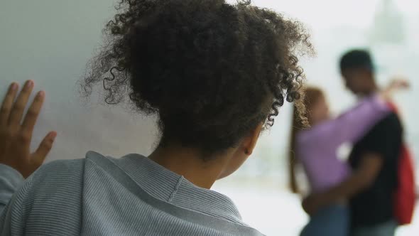 Upset Mixed-Race Girl Watching Boyfriend Cheating Outdoor, Broken-Hearted Teen