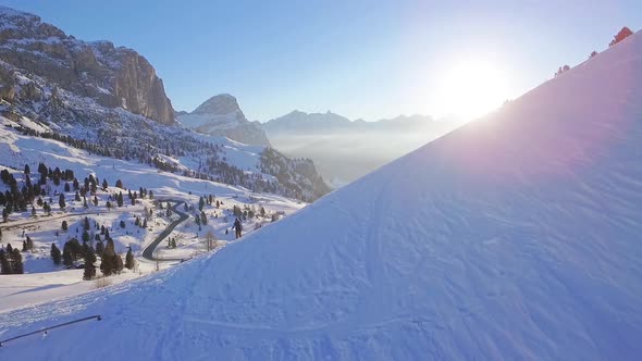 Man snowshoeing in the dolomites at sunrise