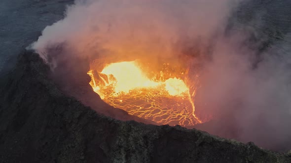 Drone Shot Of Molten Lava In Turmoil In Smoking Volcano