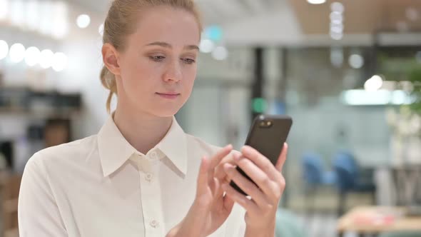 Portrait of Young Businesswoman Using Smartphone