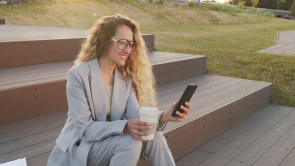 Business Woman Using Smartphone Outdoors