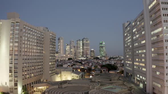 Fly between Buildings in Tel-Aviv city, night, drone shot, city view