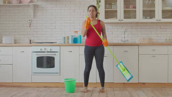 Cleaning Excited African Woman Dancing with Mop