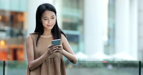 Business woman use of smart phone in the city 